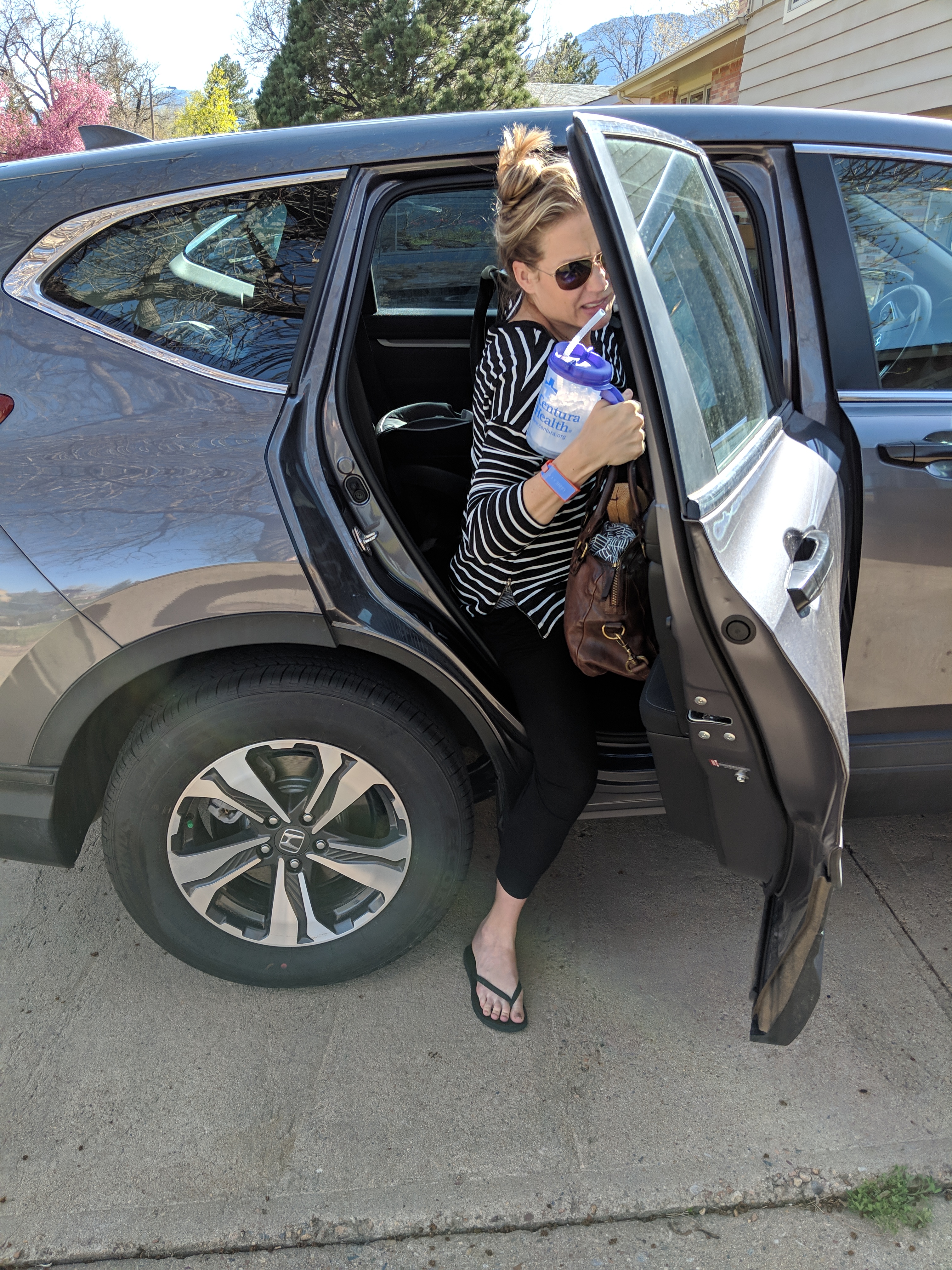 Katie steps out of the car