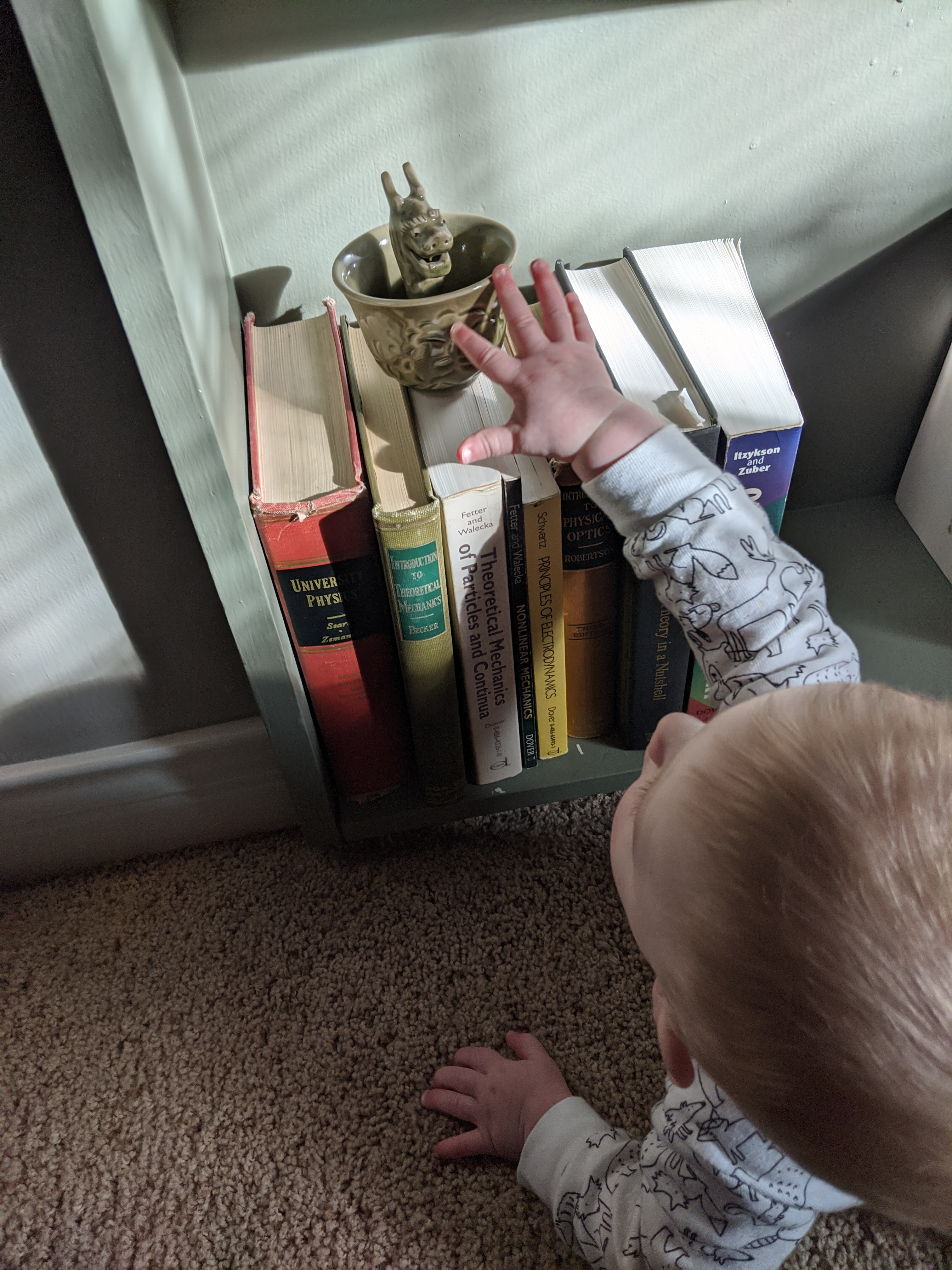 Owen reaching for tea cup