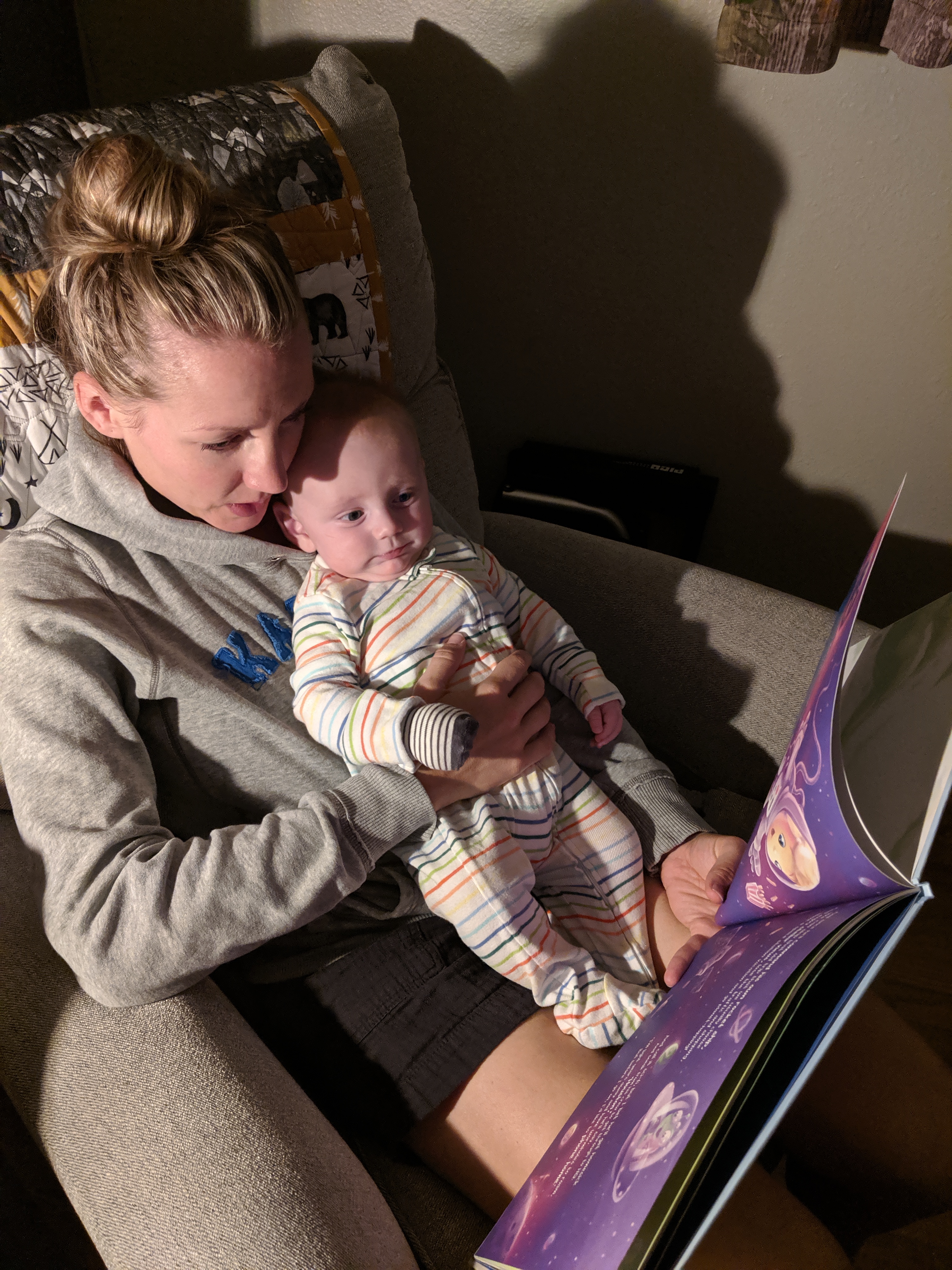 Katie reads to Owen.