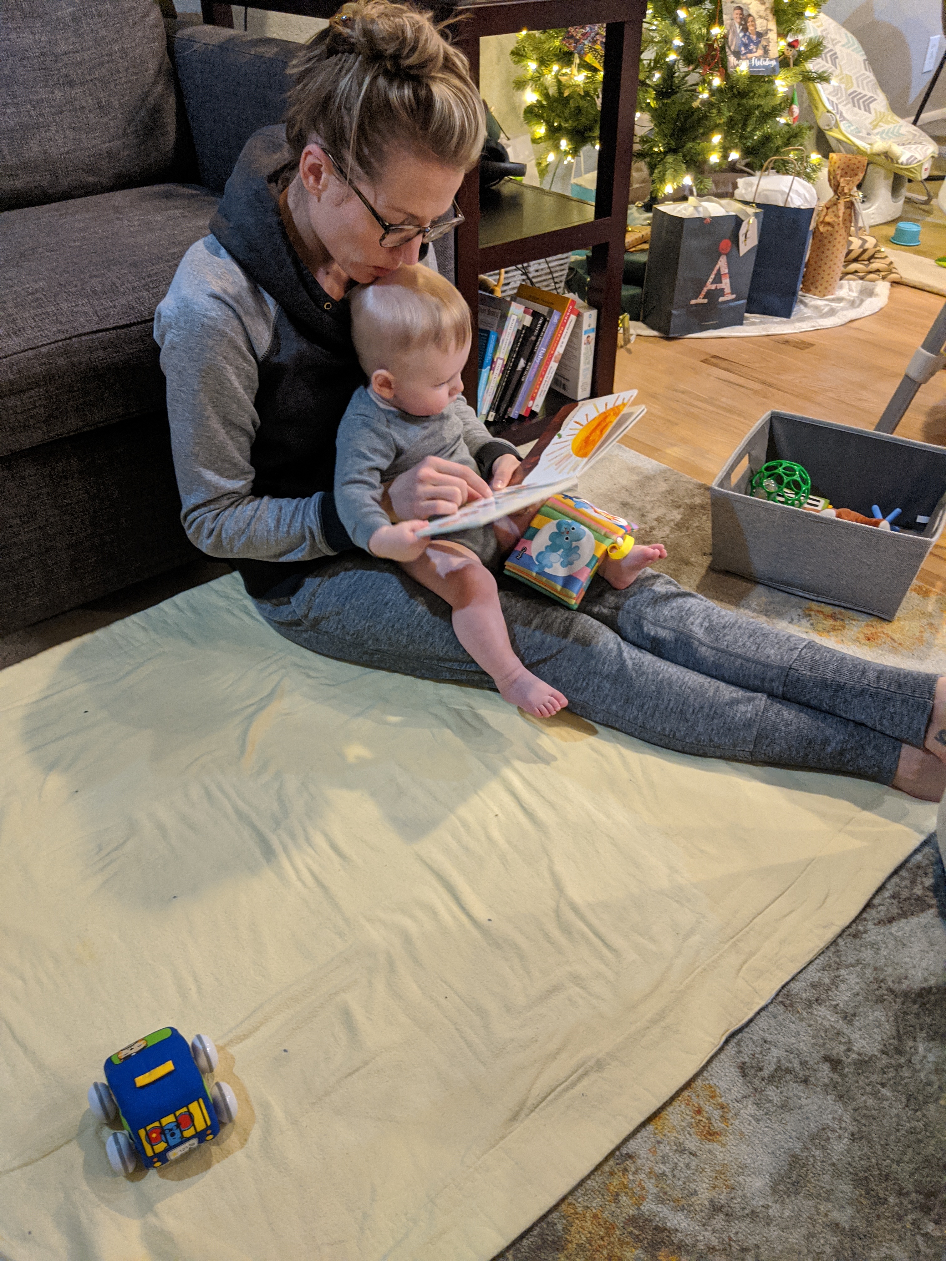 Katie reads to Owen.