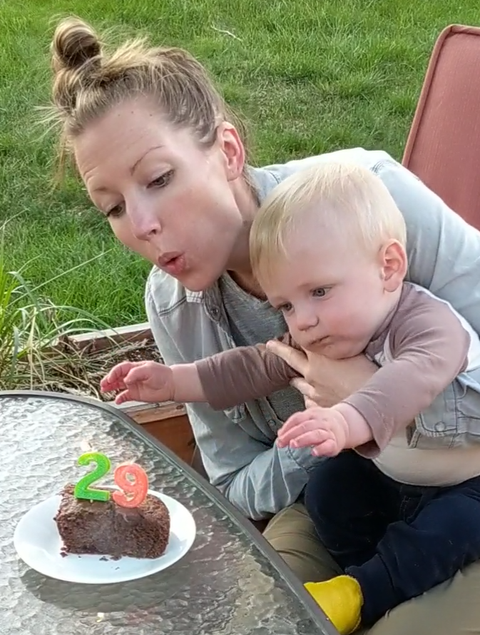 Katie blows out candles on her birthday.