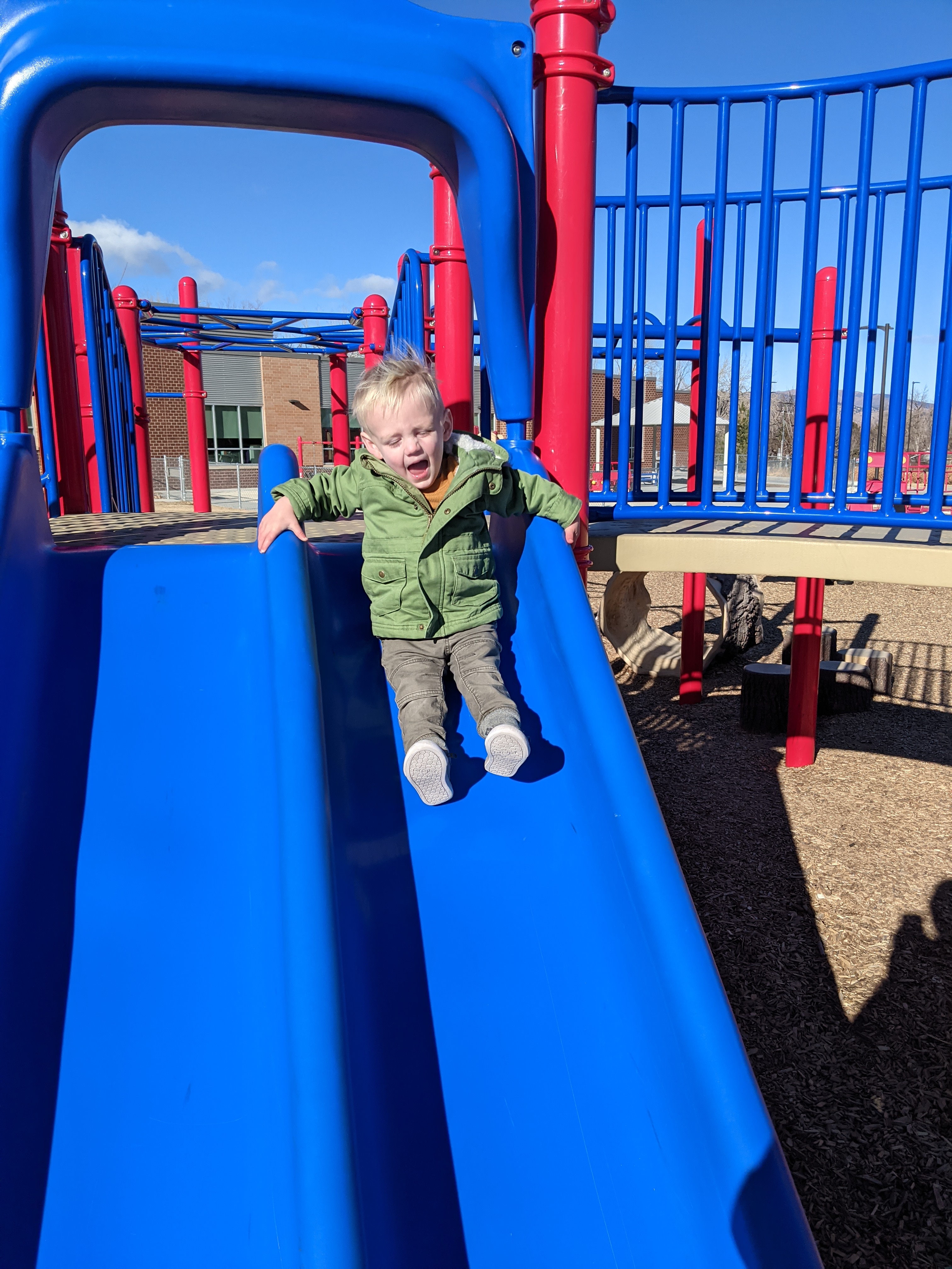 Owen going down a slide.