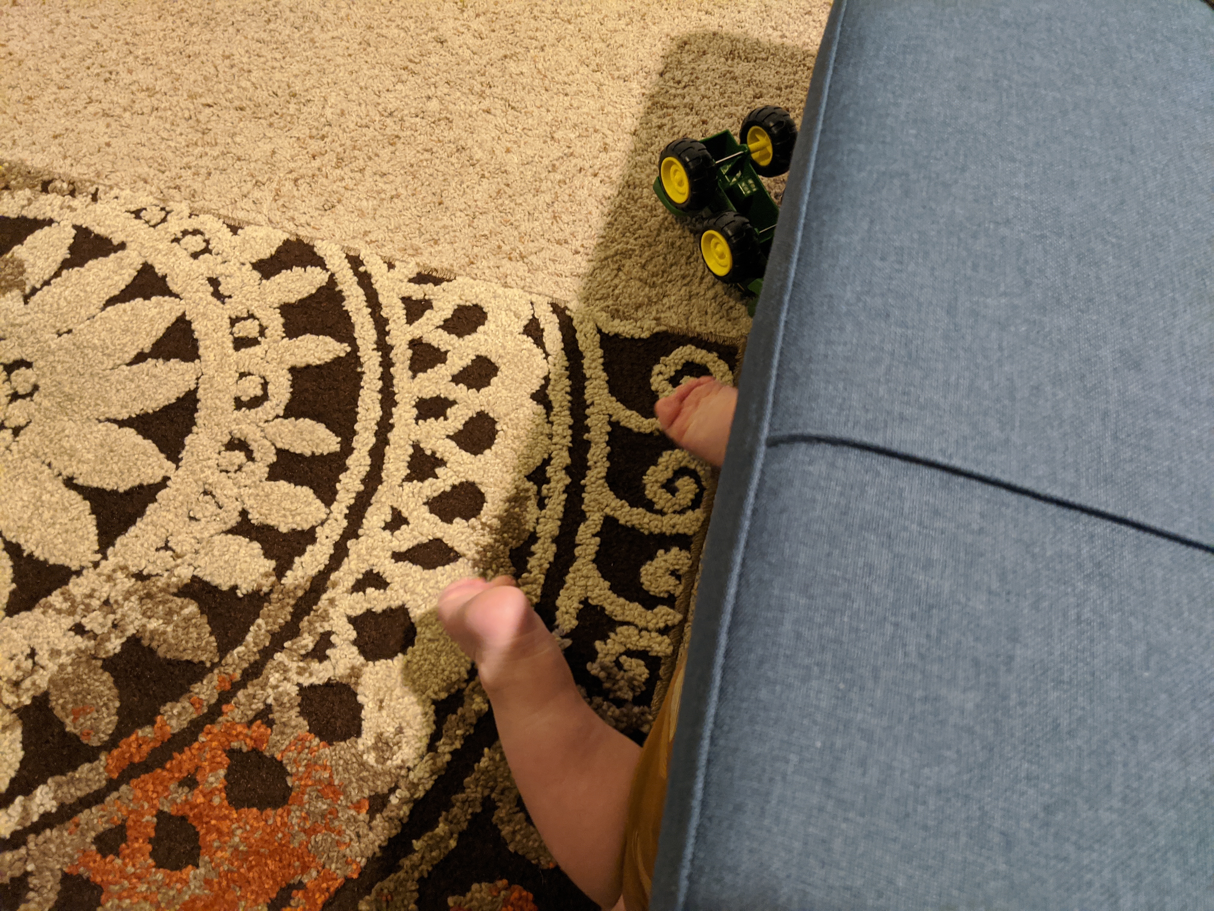 Owen goes on a reconnaissance mission under the couch.