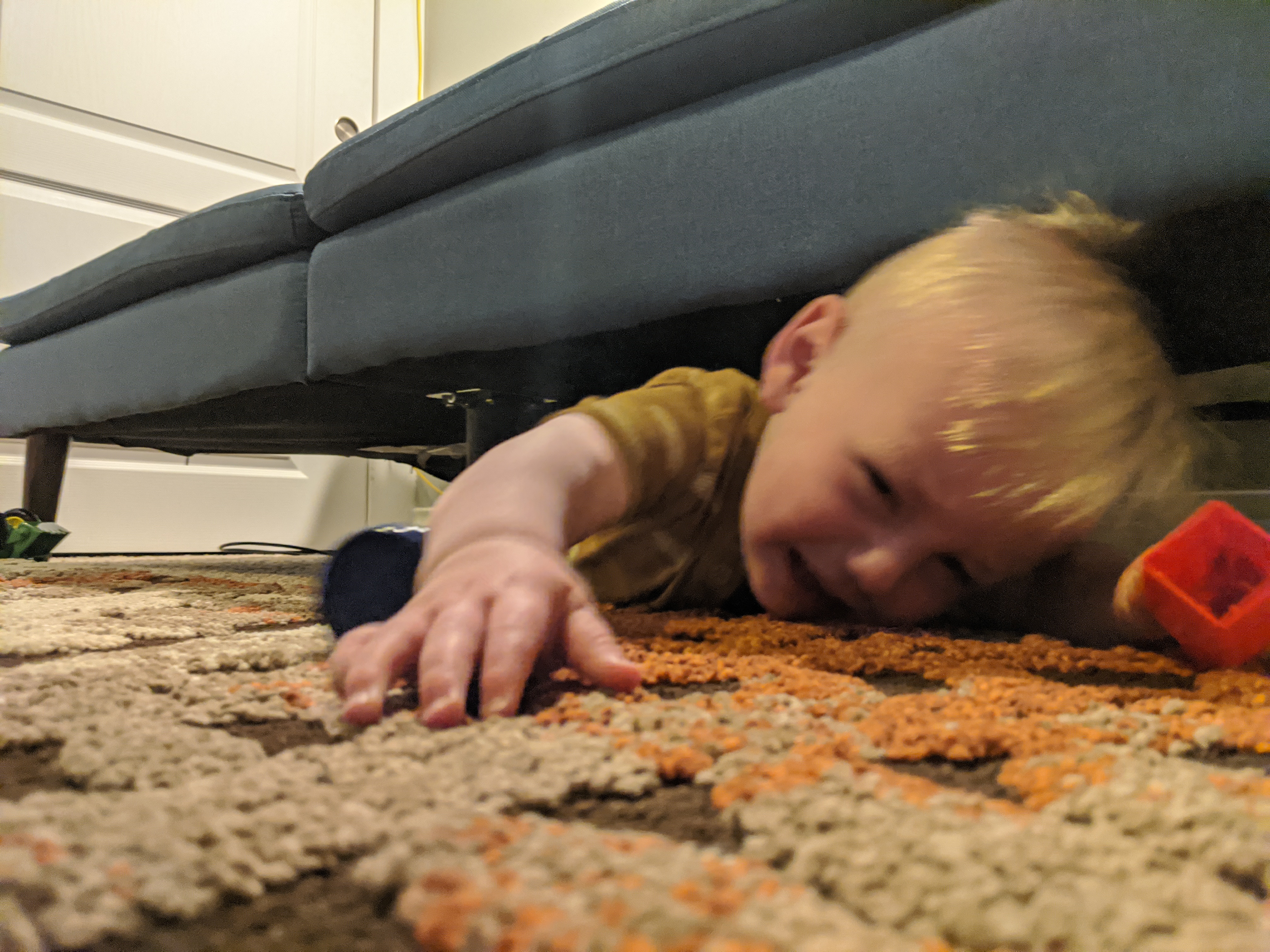 Owen goes on a reconnaissance mission under the couch.