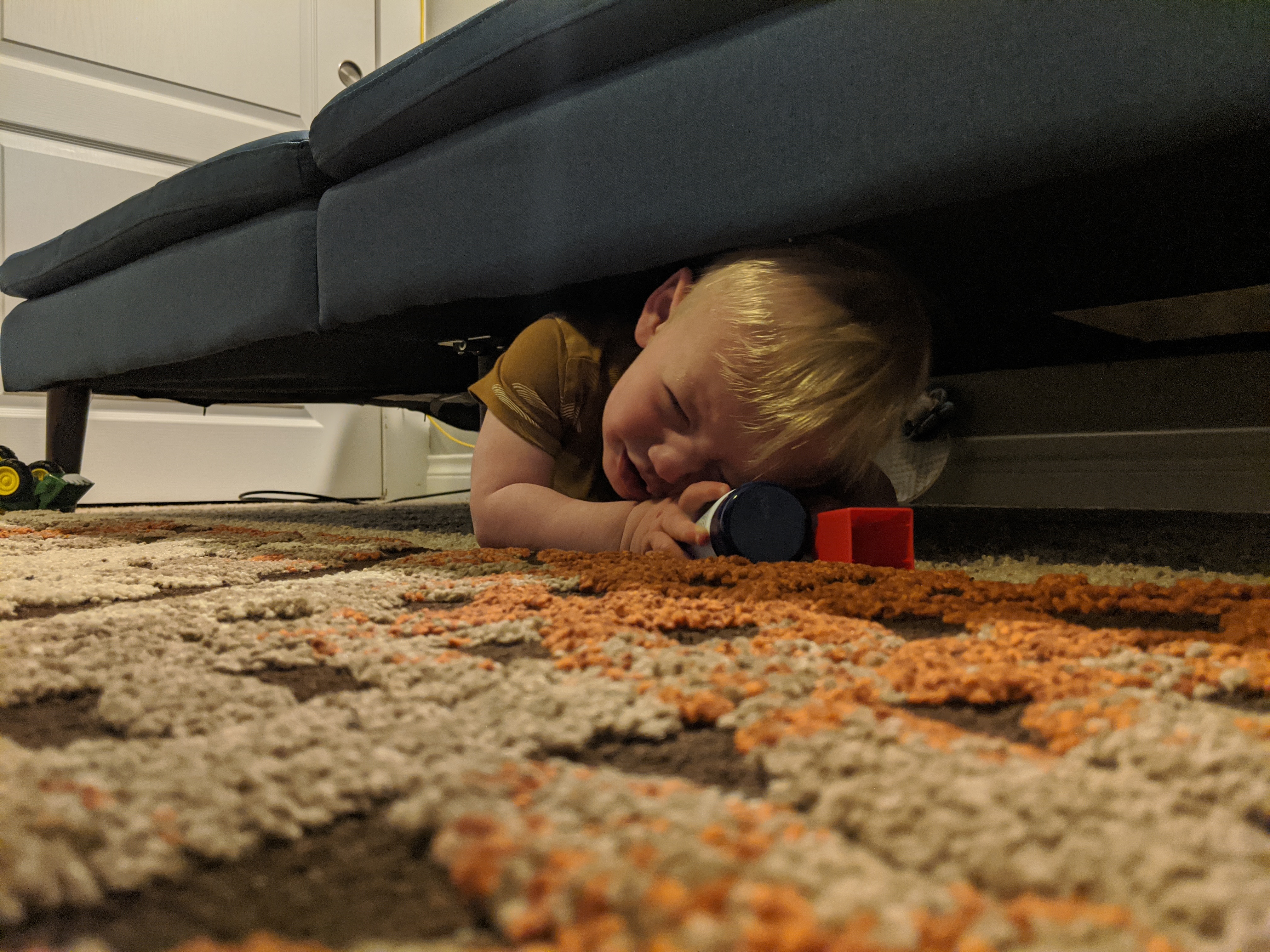 Owen goes on a reconnaissance mission under the couch.