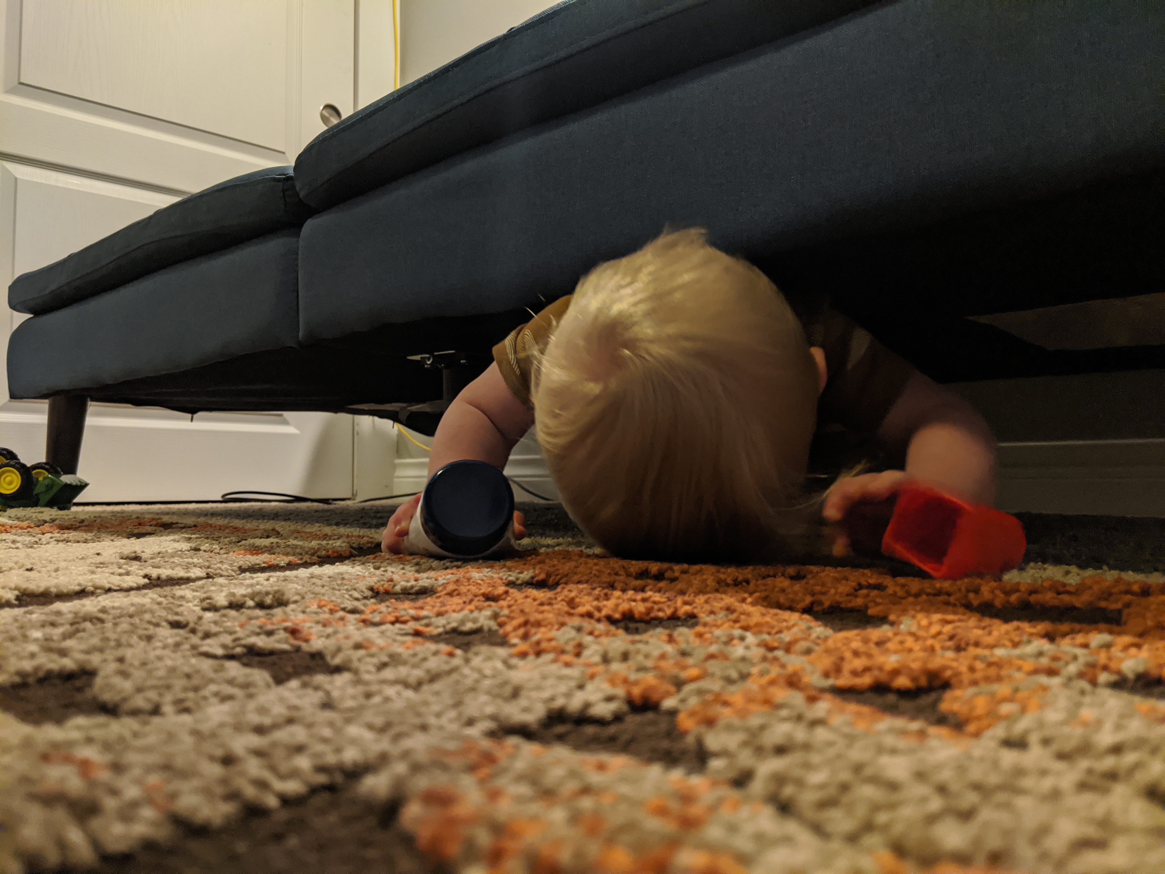 Owen goes on a reconnaissance mission under the couch.