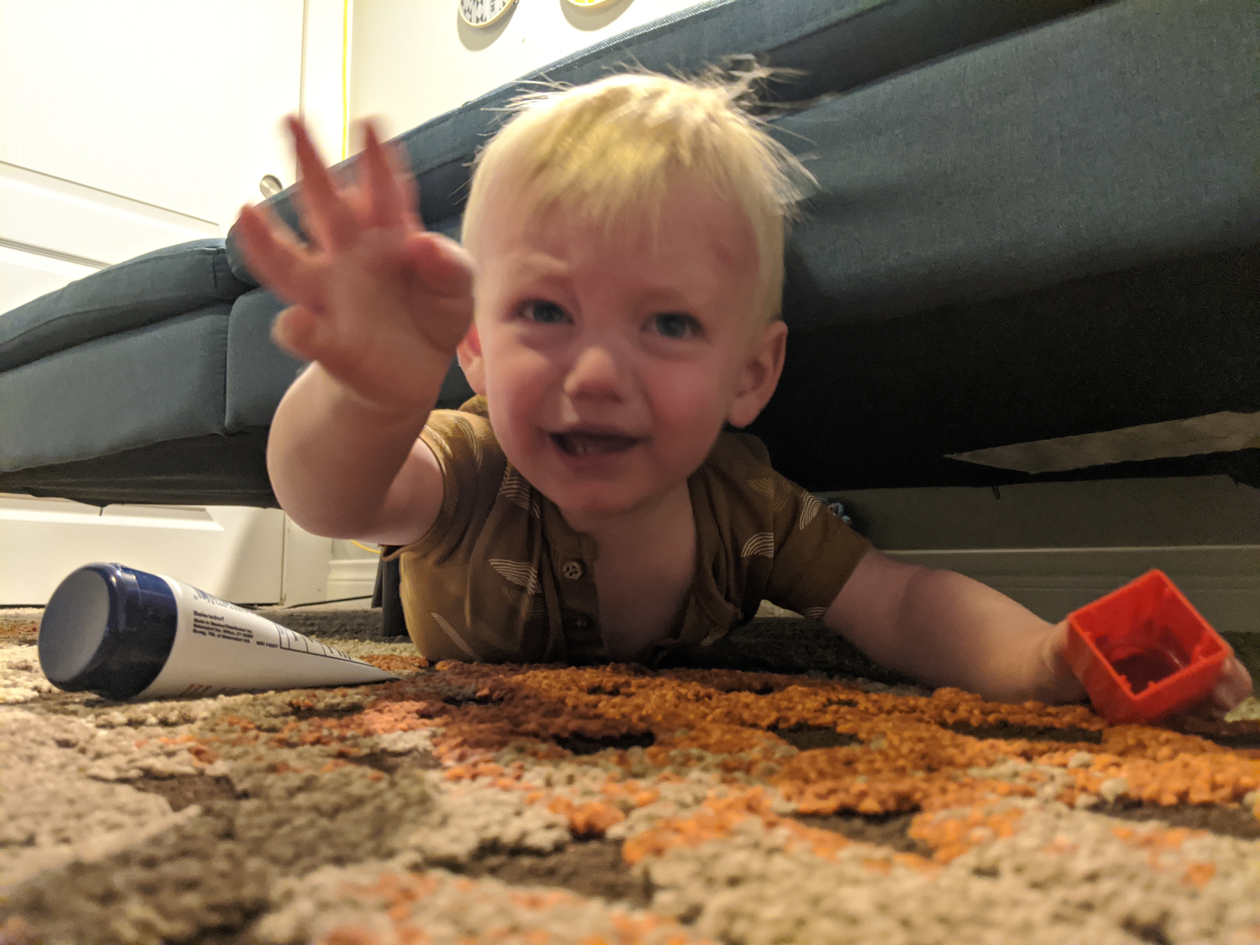 Owen goes on a reconnaissance mission under the couch.