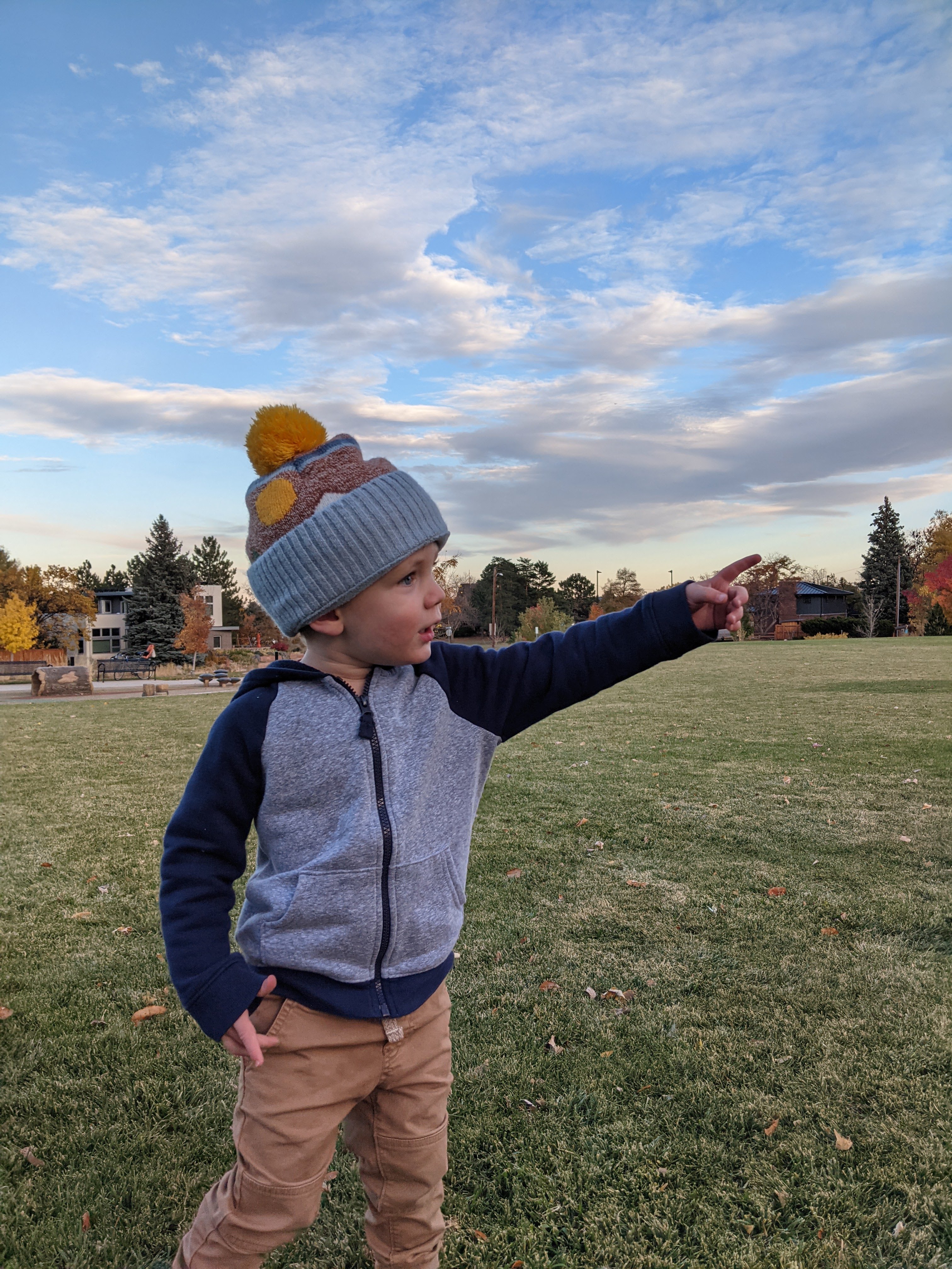 Owen pointing in a part at sunset