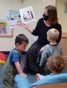 Owen observing his teacher reading at school